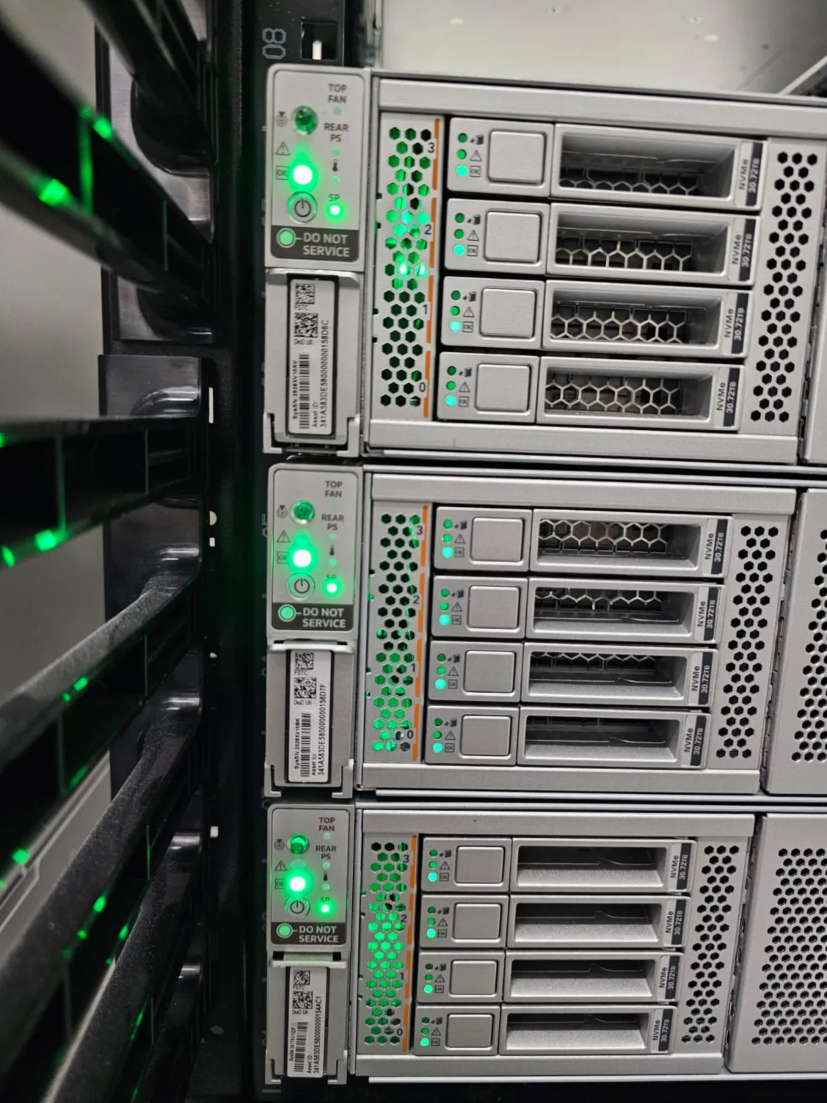 Front panel of rack mounted compute nodes with status indicators lit