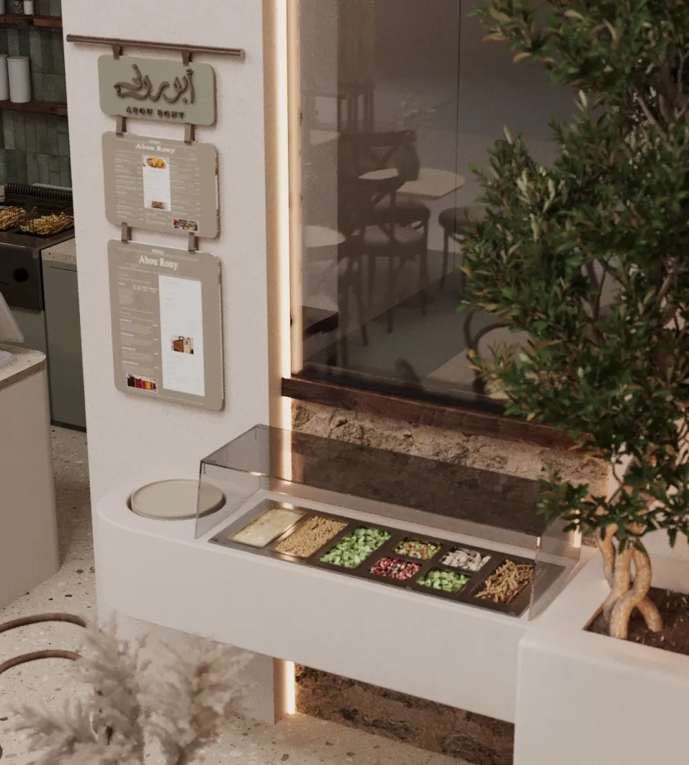 Condiment counter with menu boards above and an olive tree alongside