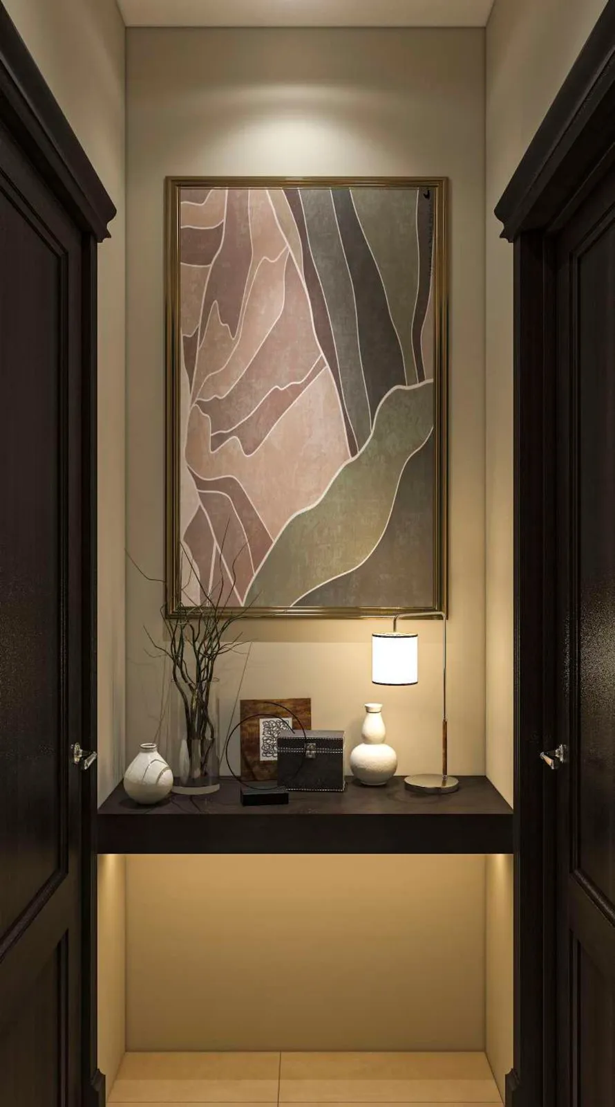 Washroom lobby with framed artwork, a console with a table lamp and warm under lighting