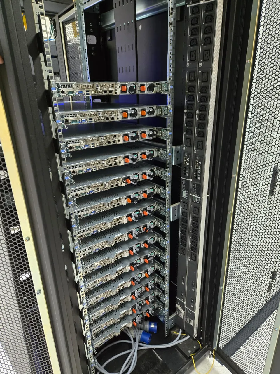 Rear of a rack showing servers on rails and dual vertical power distribution units